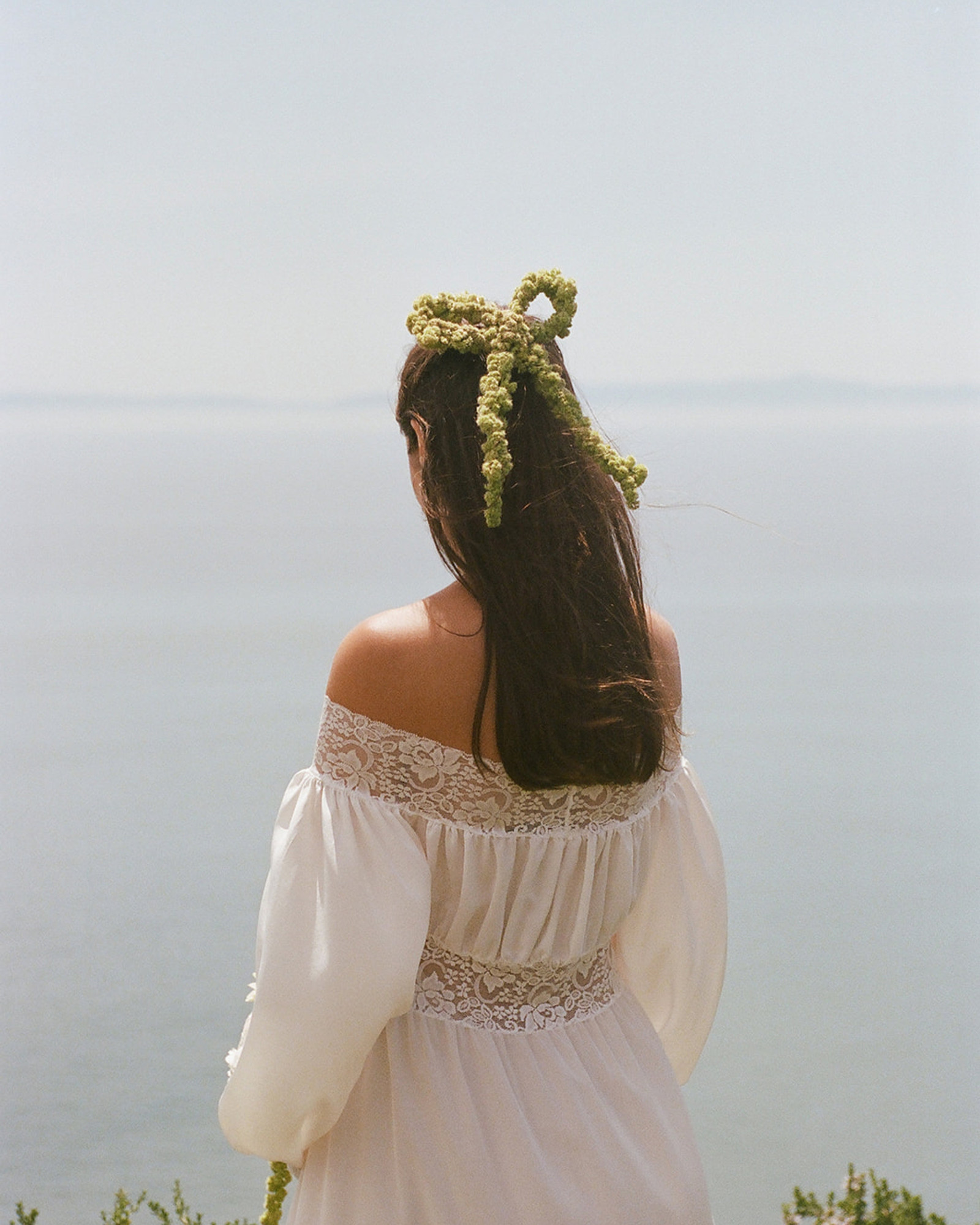 Coastal wedding editorial with amaranthus floral hair piece
